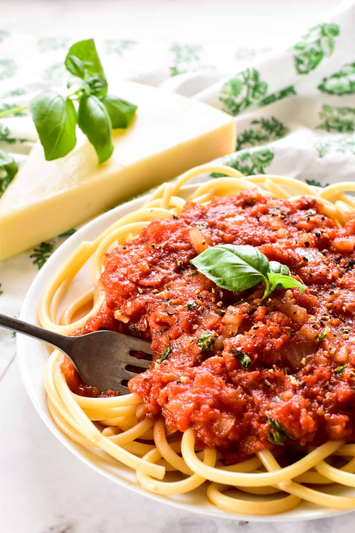 Plate of pasta with Homemade Marinara Sauce and fresh basil