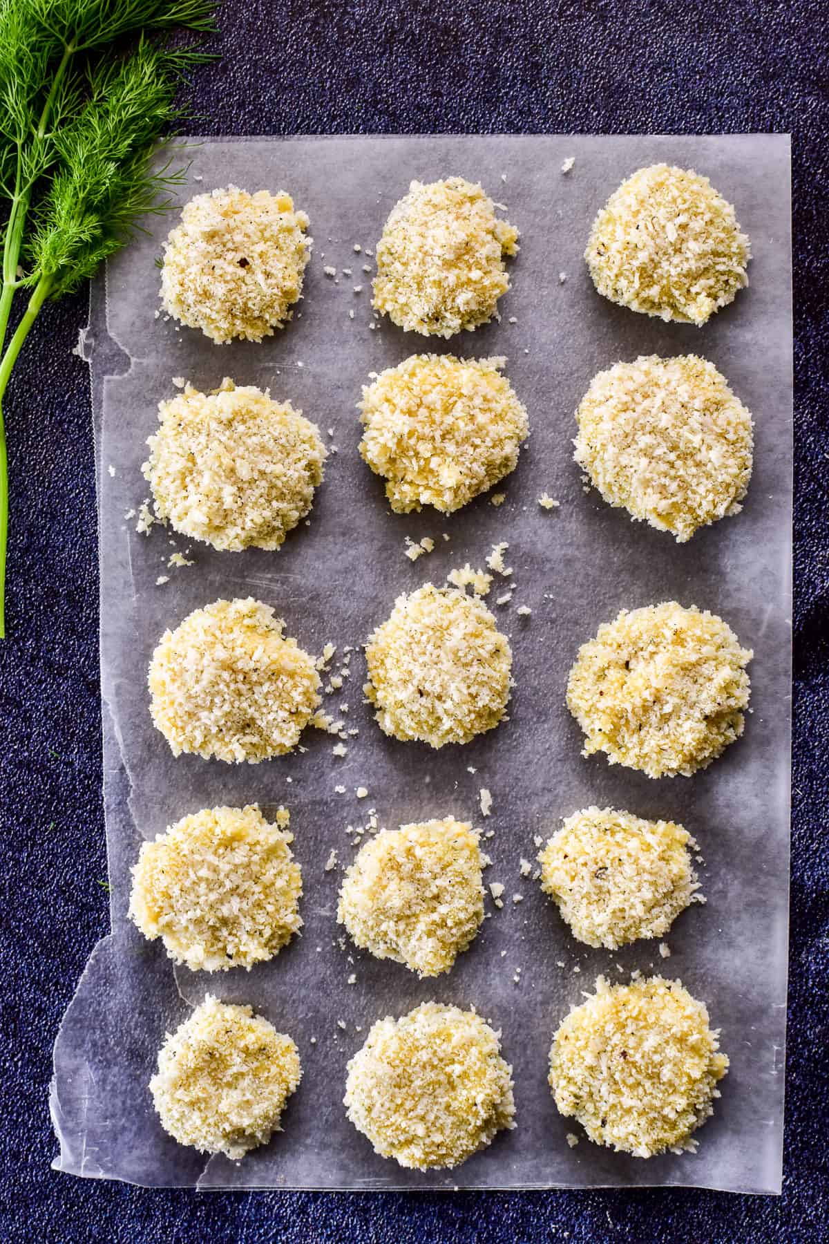 Breaded pickles on wax paper