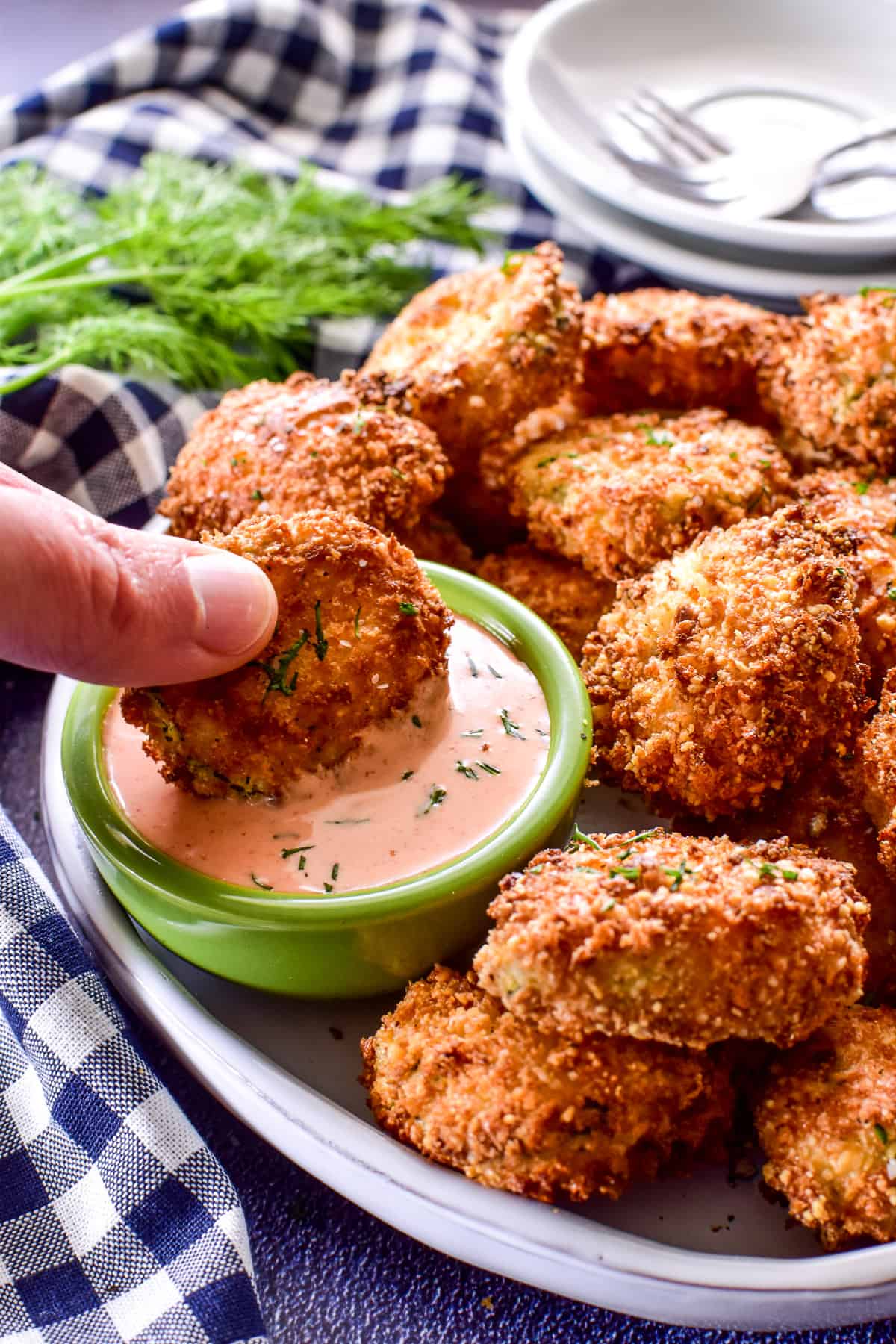 Air Fryer Pickle being dipped into sauce