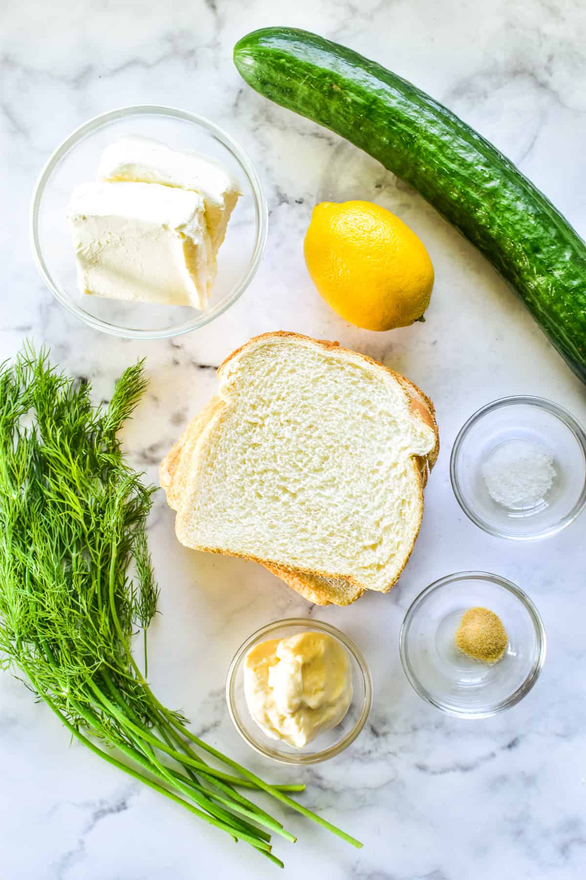 Cucumber Sandwich ingredients on a marble board