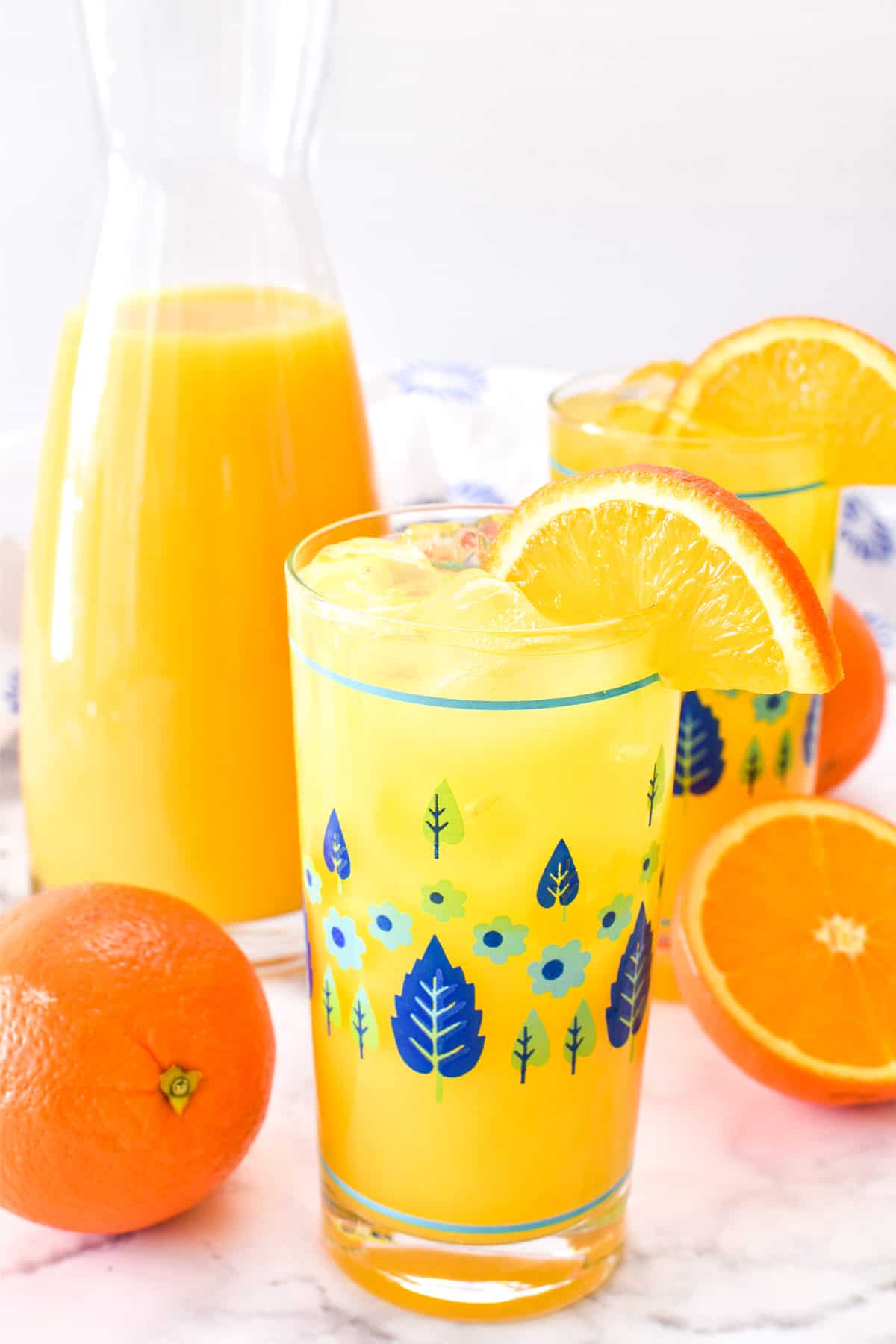 Screwdriver in a patterned glass with an orange slice