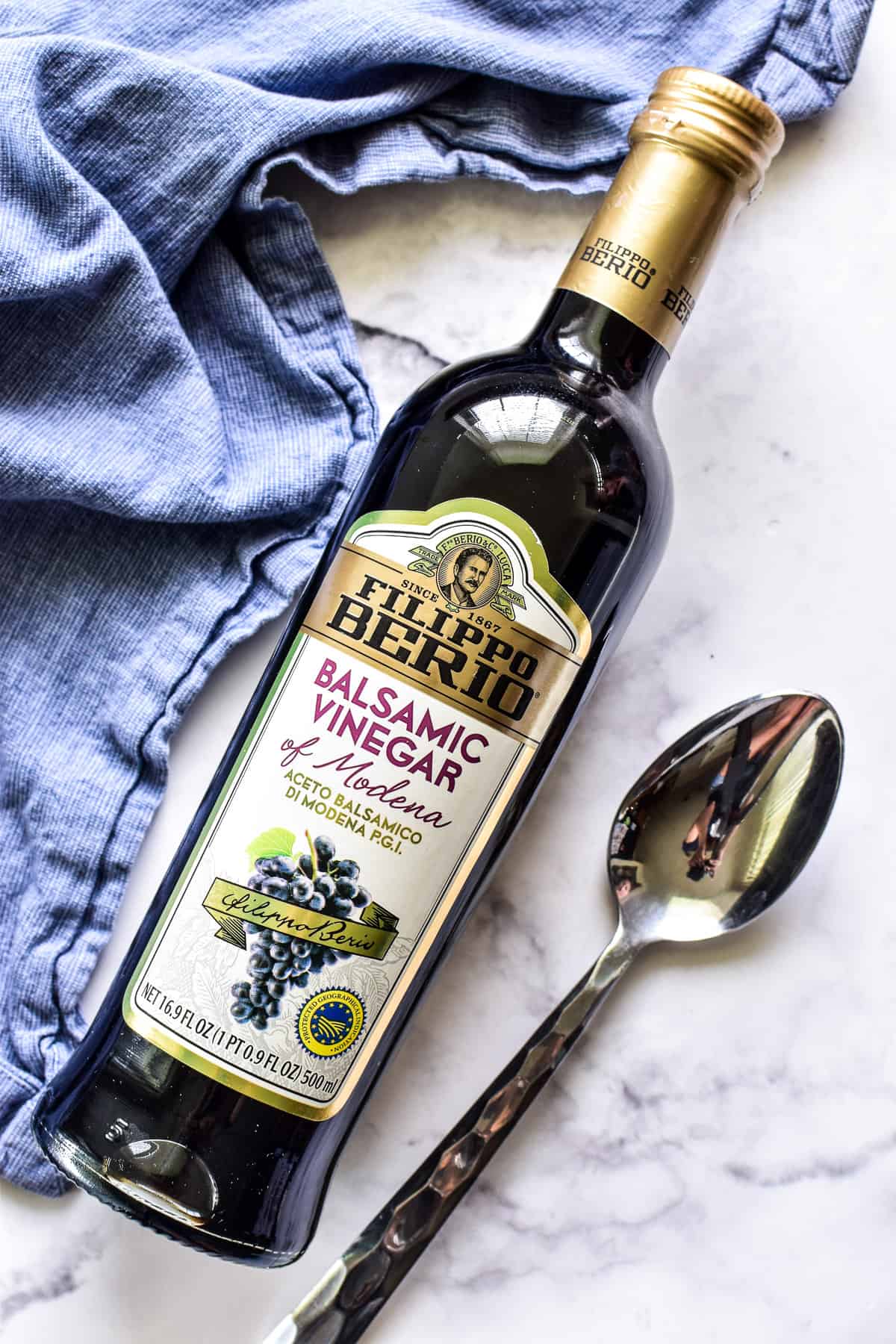 Bottle of balsamic vinegar with a spoon
