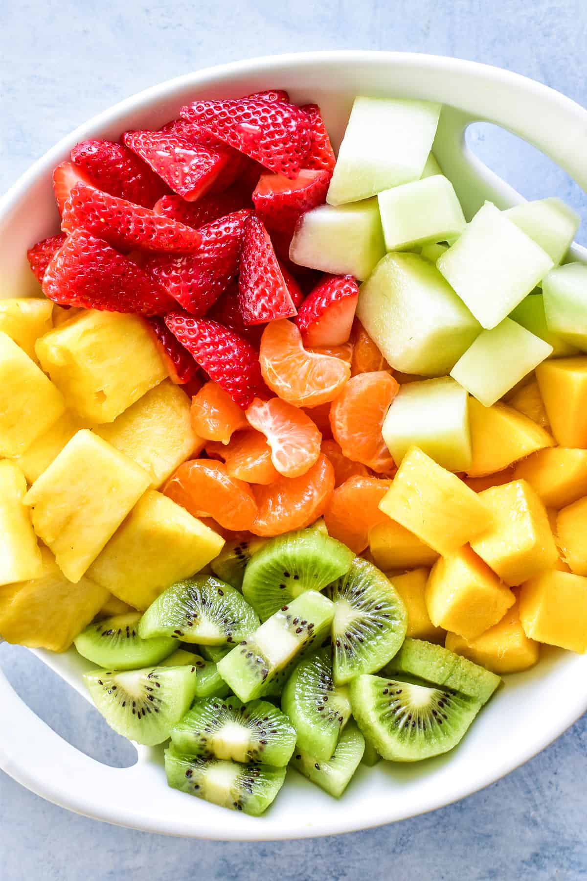 Tropical fruits in a white bowl