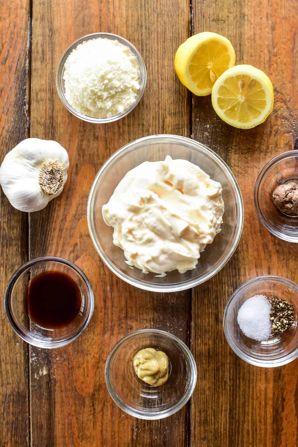 Caesar Salad Dressing ingredients on a wooden table