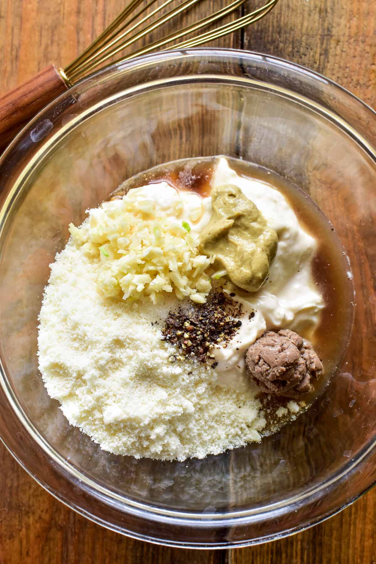 Caesar Dressing ingredients in a mixing bowl