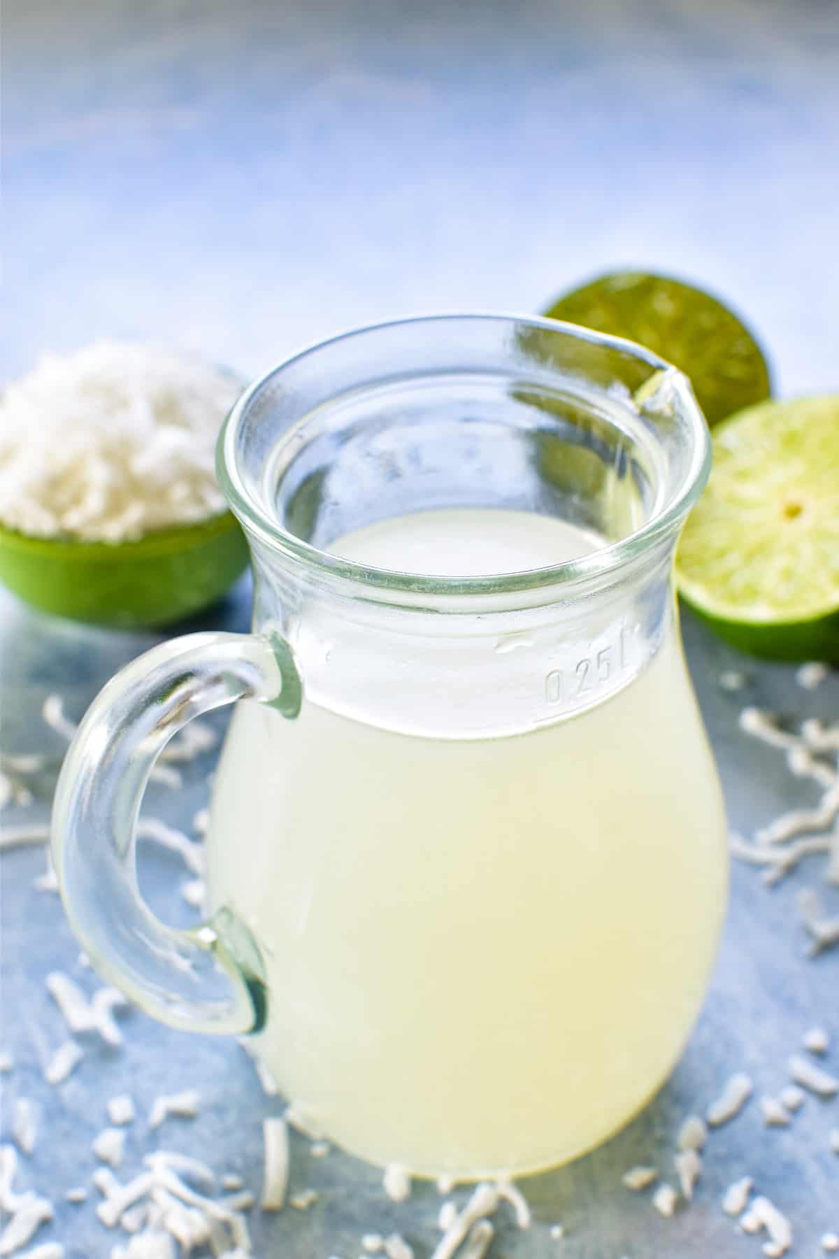 Coconut Lime Simple Syrup in a small pitcher