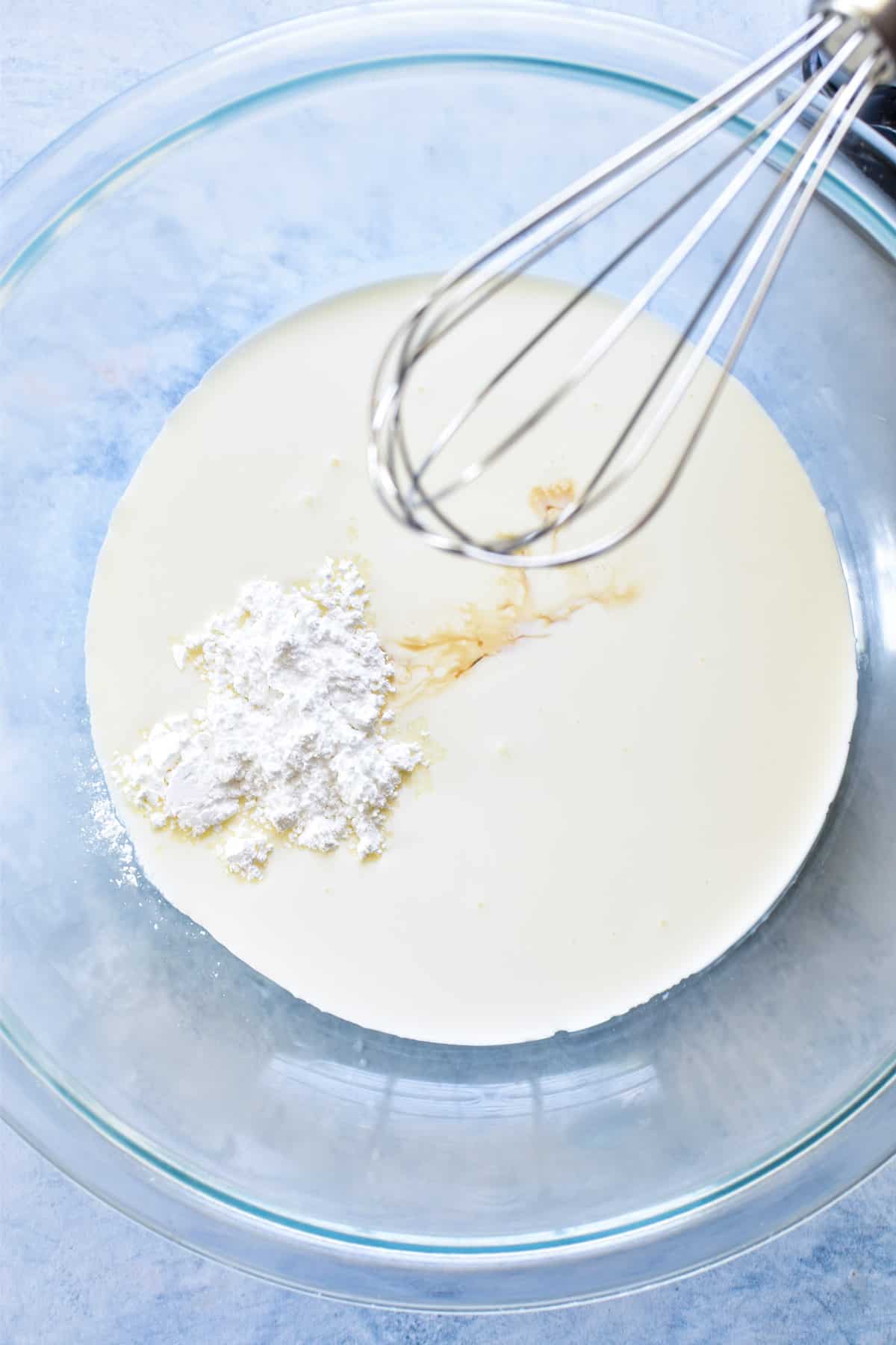 Homemade Cool Whip ingredients in a mixing bowl