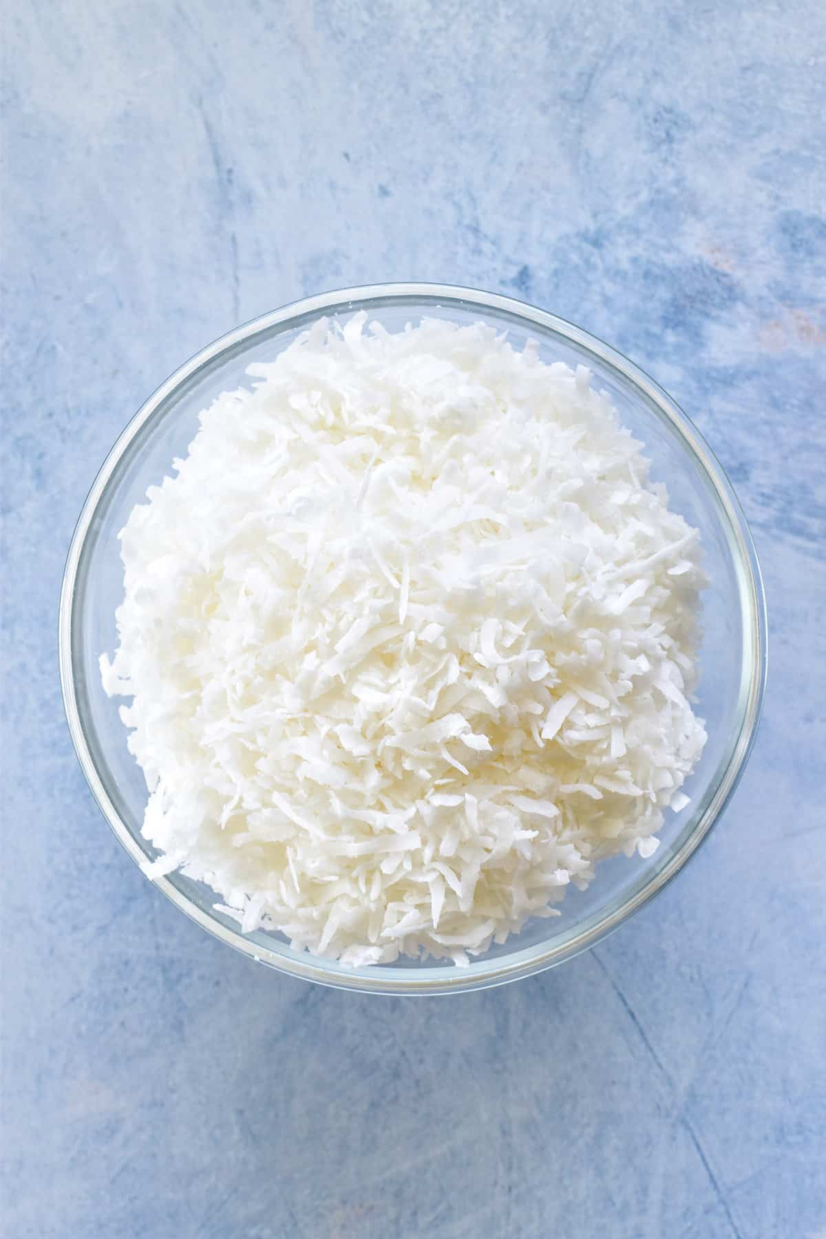 Shredded coconut in a glass bowl