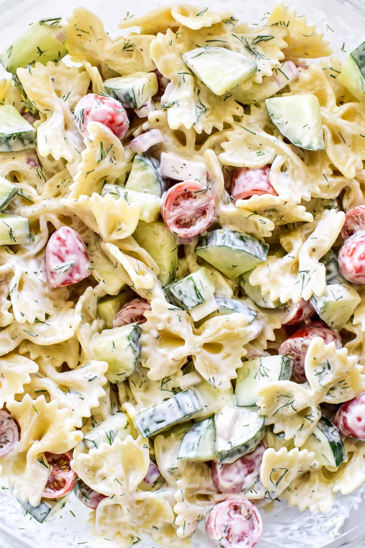 Cucumber Pasta Salad in a glass mixing bowl