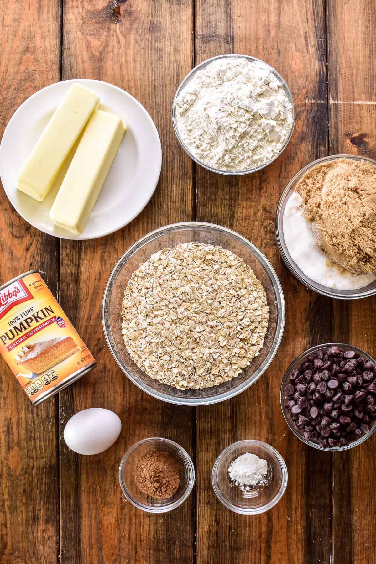 Pumpkin Oatmeal Chocolate Chip Cookie ingredients on a wooden board