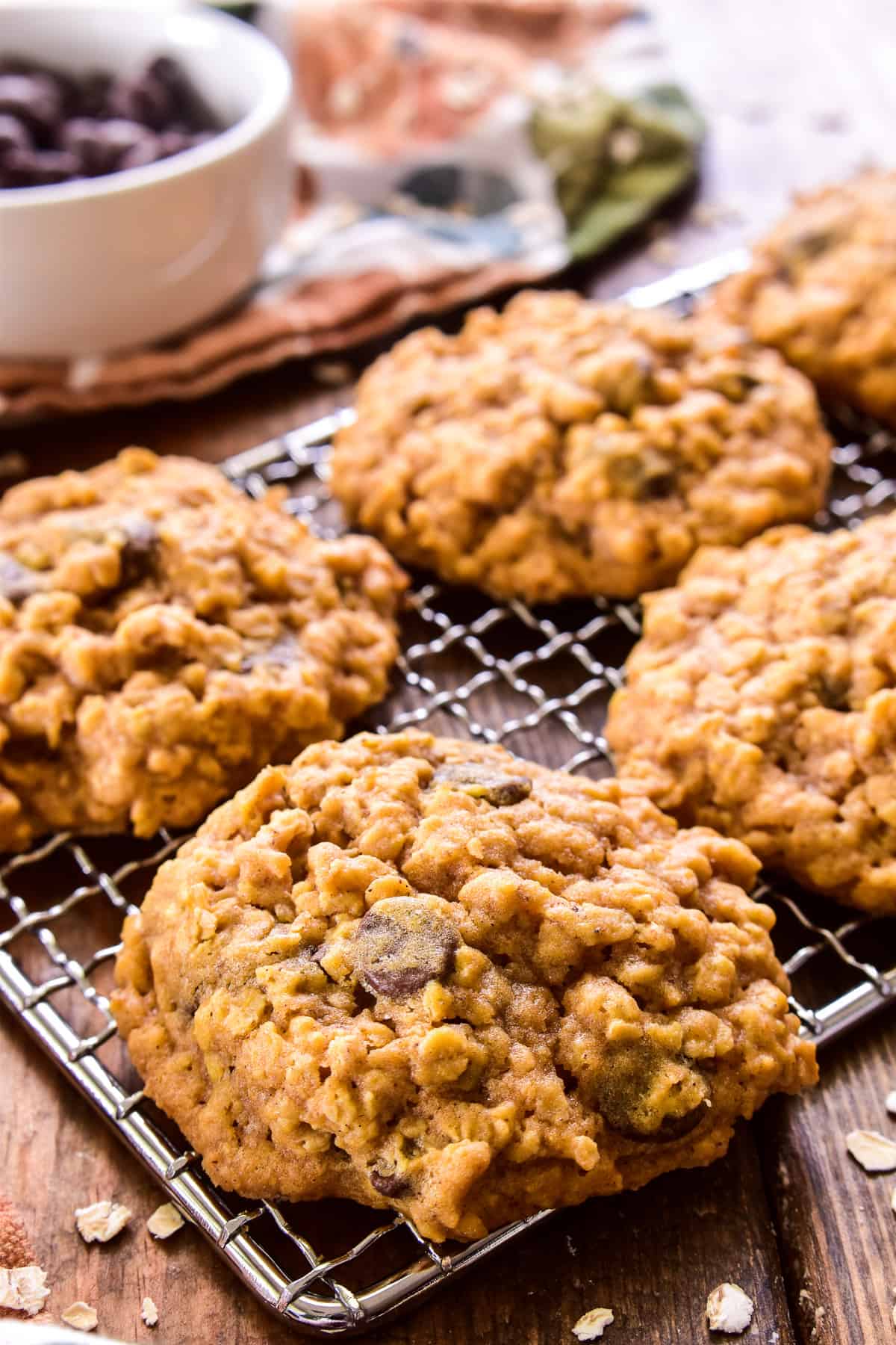 Close up of Pumpkin Oatmeal Chocolate Chip Cookies on a wire rack