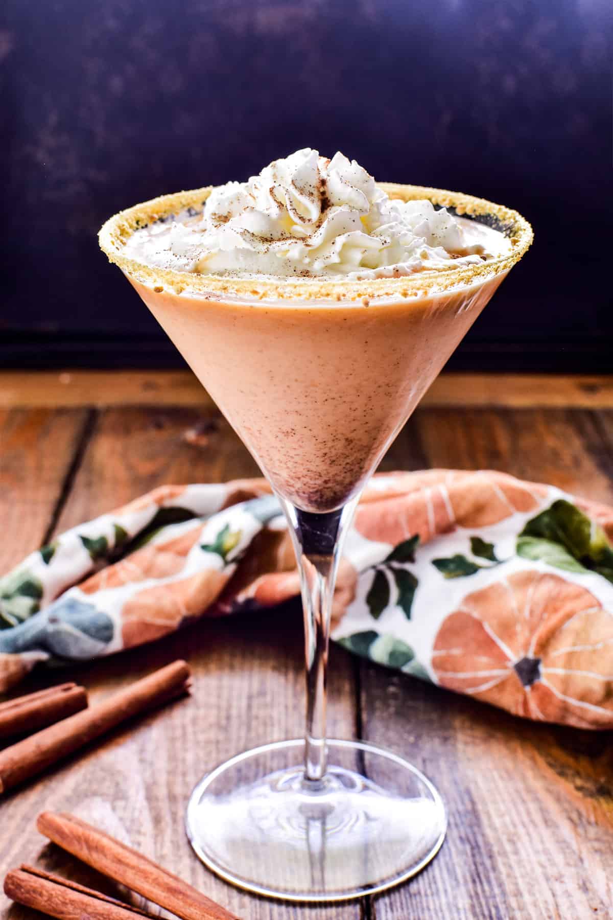 Pumpkin Pie Martini in a martini glass with a fall themed napkin