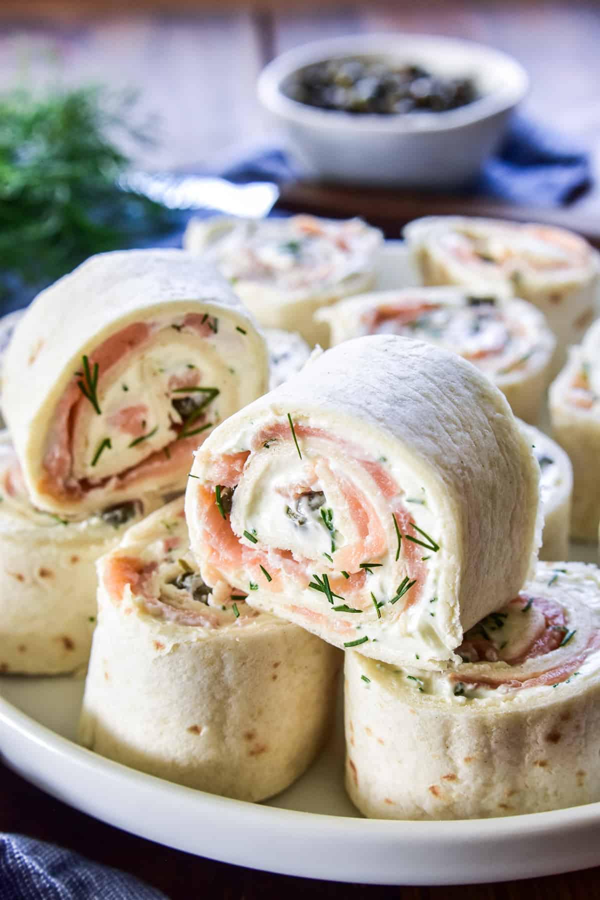 Close up of Lox Cream Cheese Pinwheels on a white plate