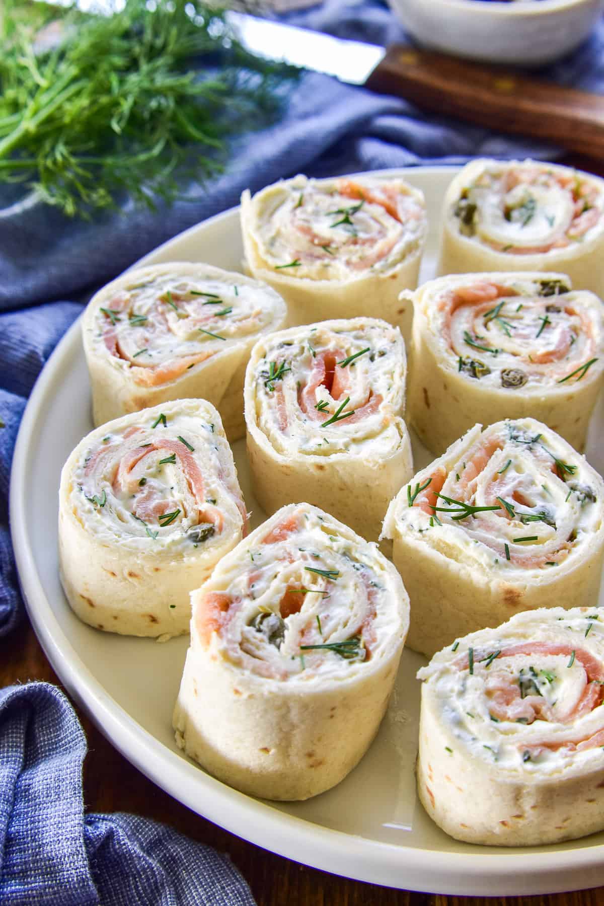 Side view of Lox Cream Cheese Pinwheels with fresh dill