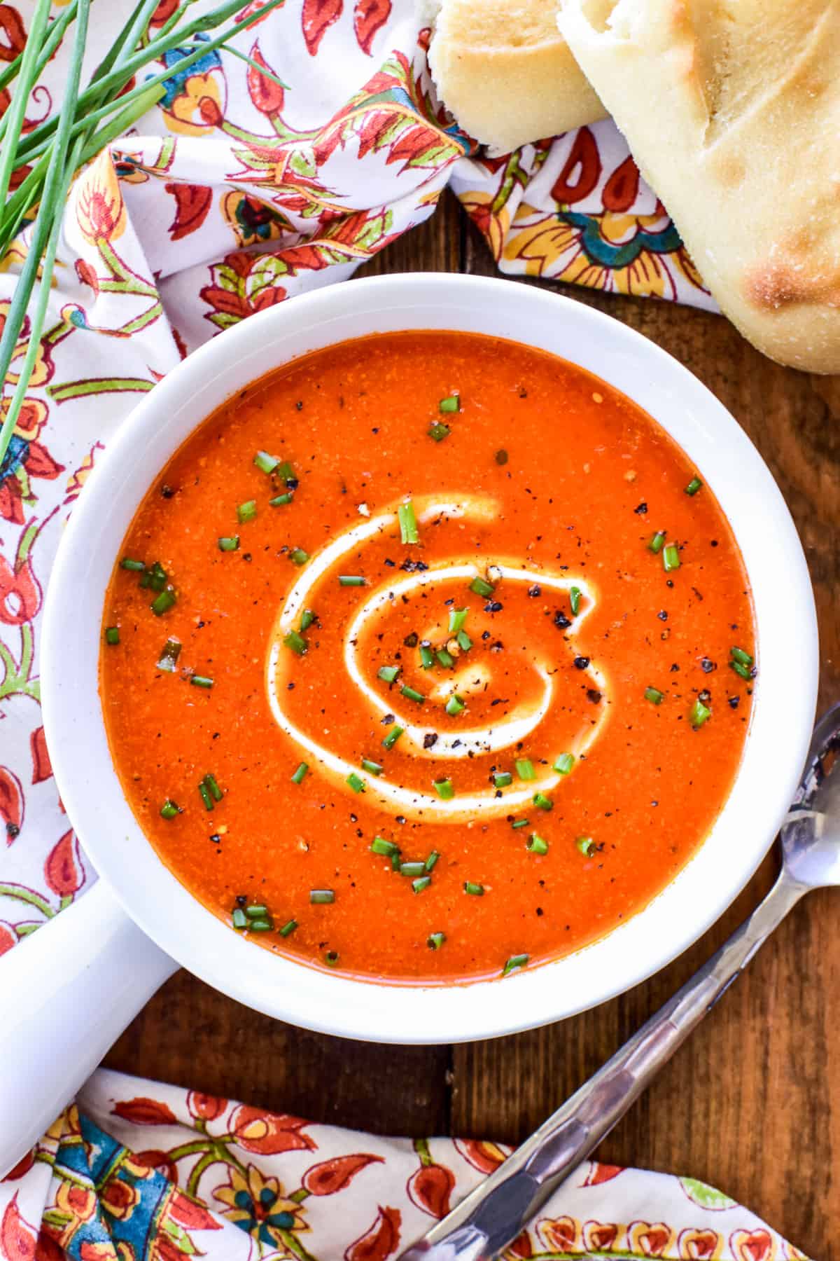 Overhead image of Roasted Red Pepper Soup with sour cream & chives