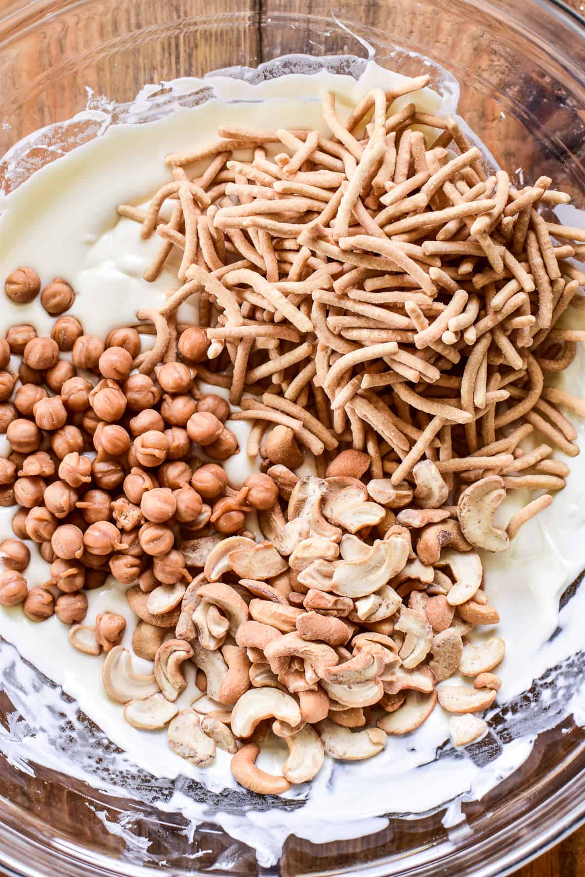 Melted white chocolate with chow mein noodles, cashews, and caramel bits