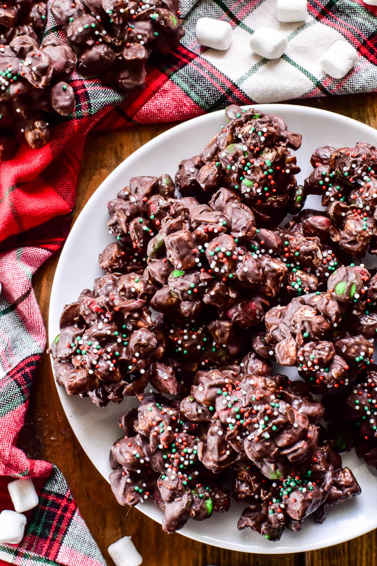 Rocky Road candy decorated with red & green sprinkles with a festive holiday napkin