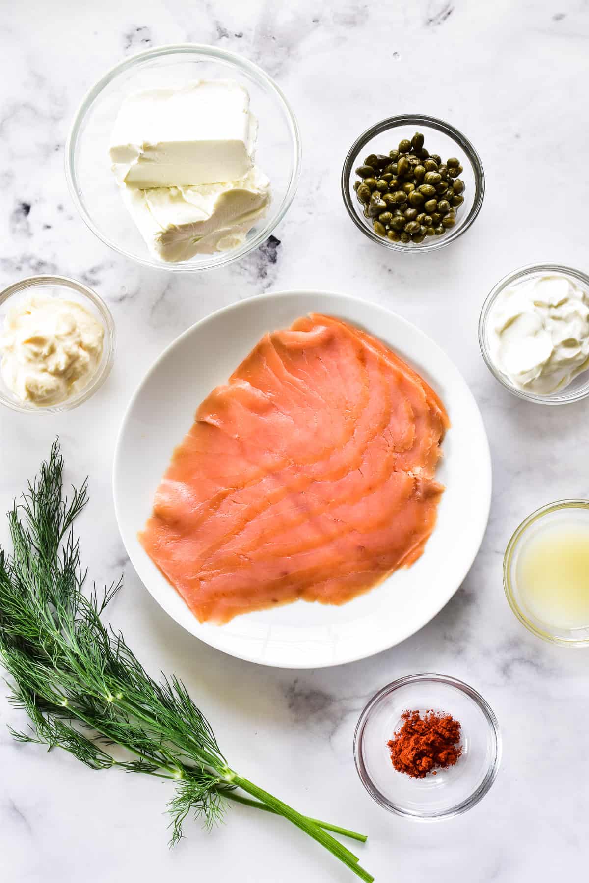 Smoked Salmon Dip ingredients on a marble slab