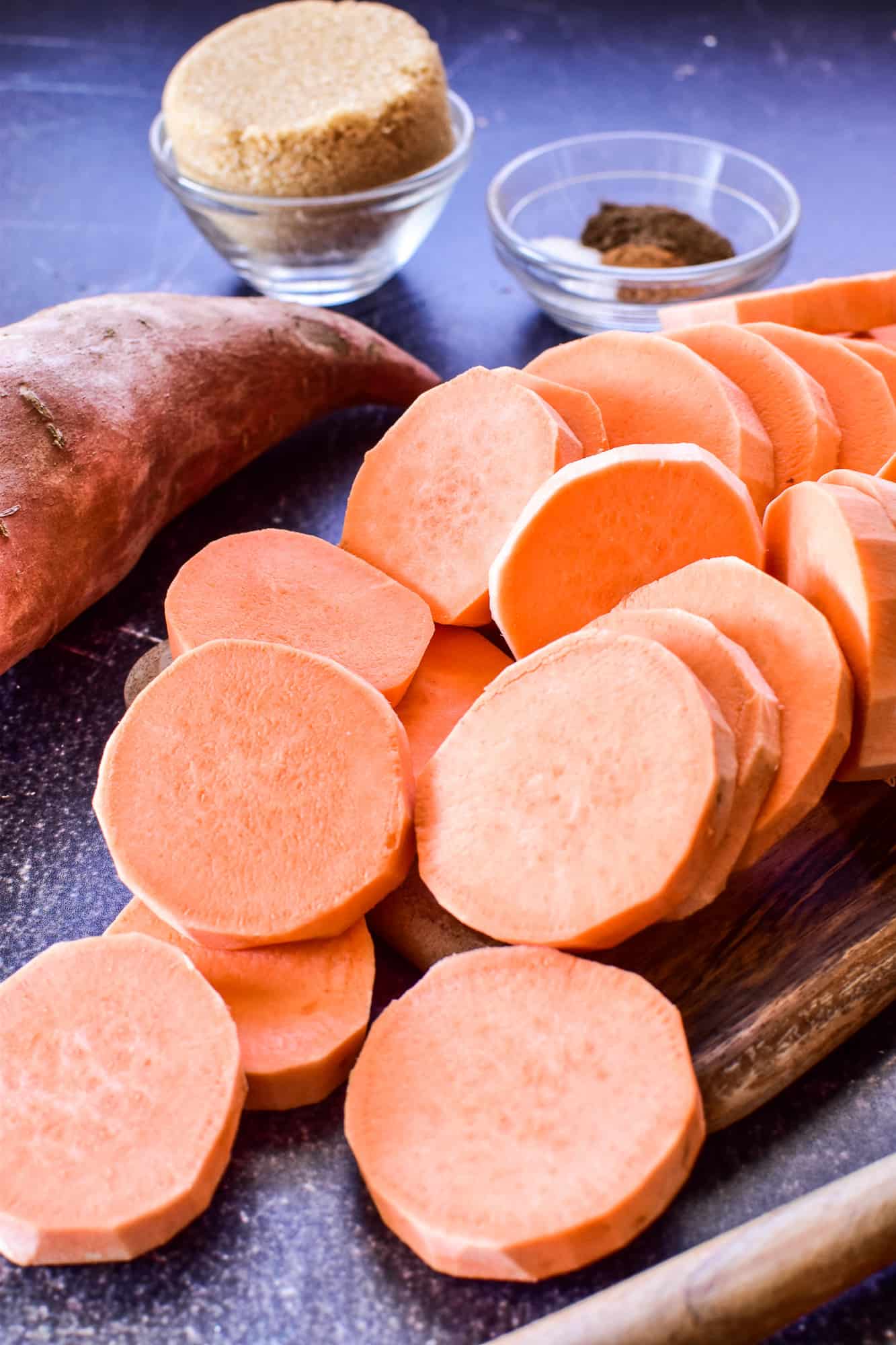 Peeled, sliced sweet potatoes with brown sugar and spices
