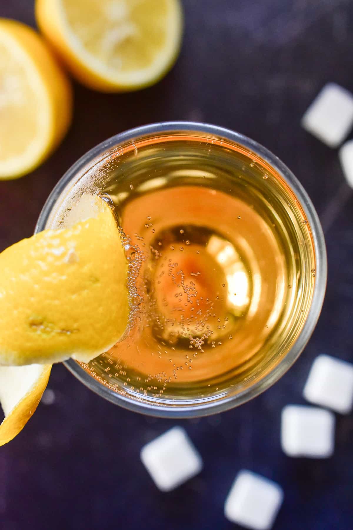 Overhead image of Champagne Cocktail with lemon peel