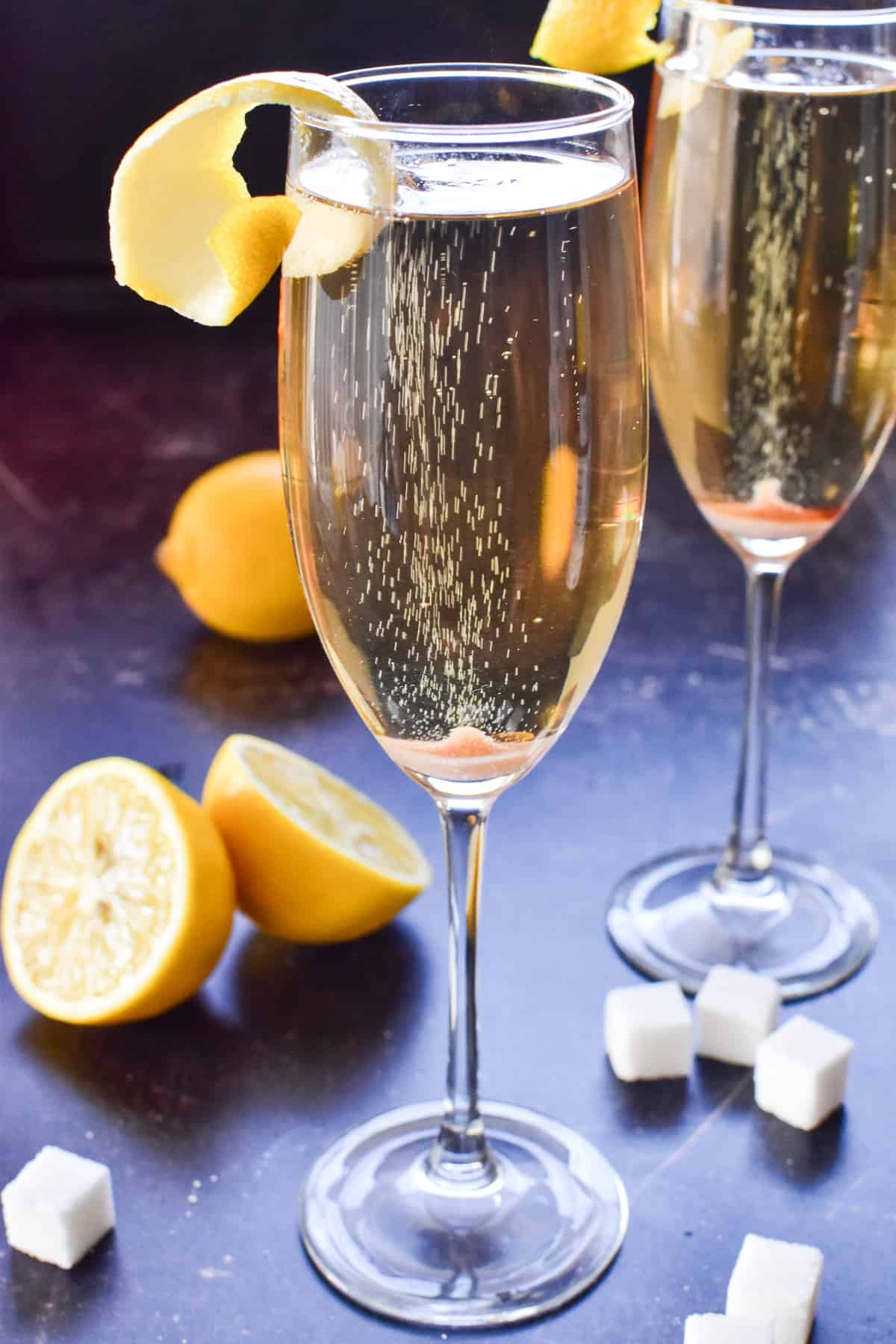 Champagne Cocktails with lemon rind