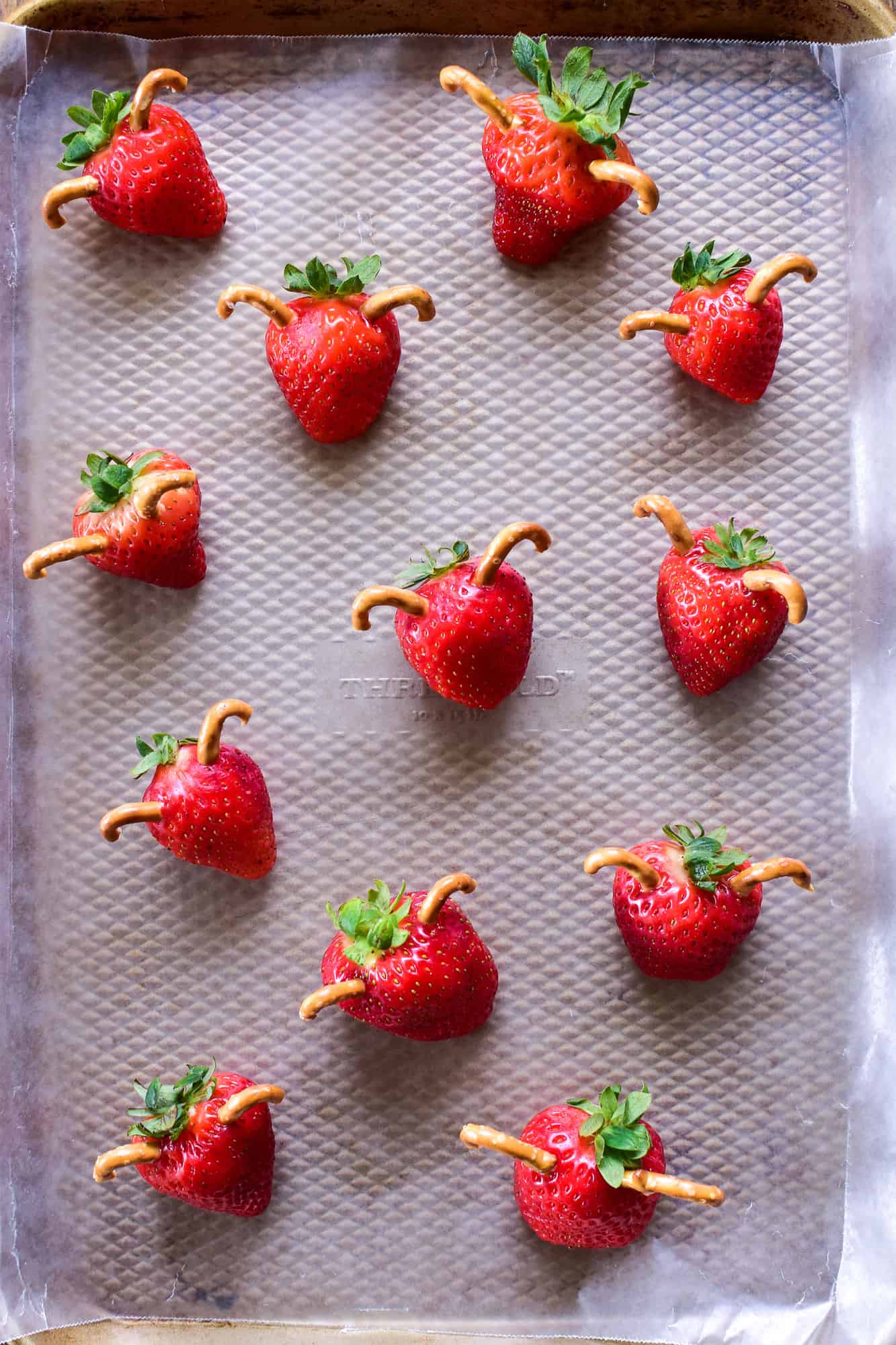 Fresh strawberries with pretzel antlers