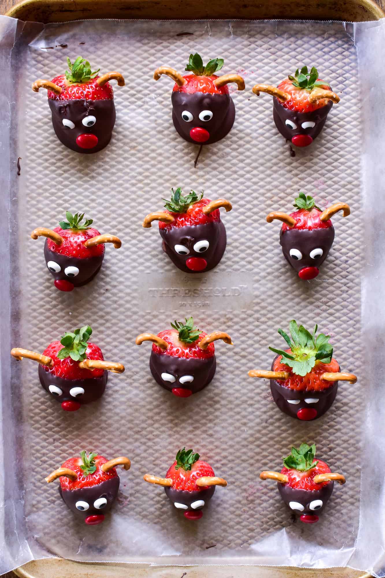 Overhead image of Chocolate Covered Strawberry Reindeer on parchment paper