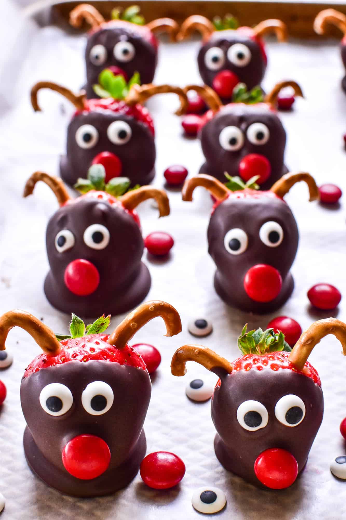Chocolate Covered Strawberry Reindeer on a rimmed baking sheet