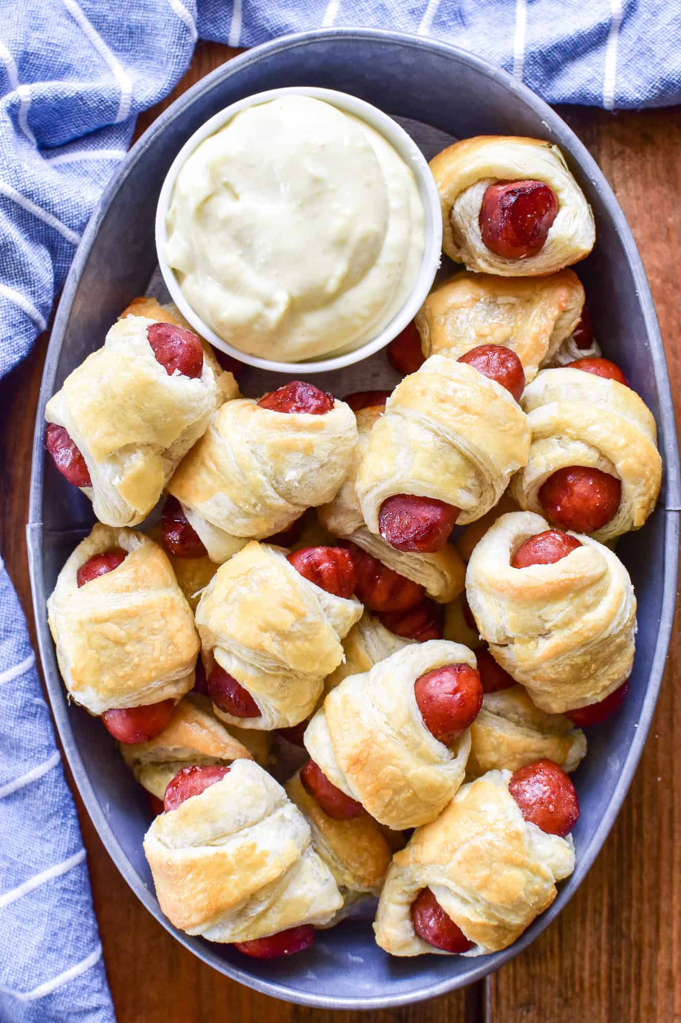 Overhead image of Pigs in a Blanket with Wasabi Mayo Sauce