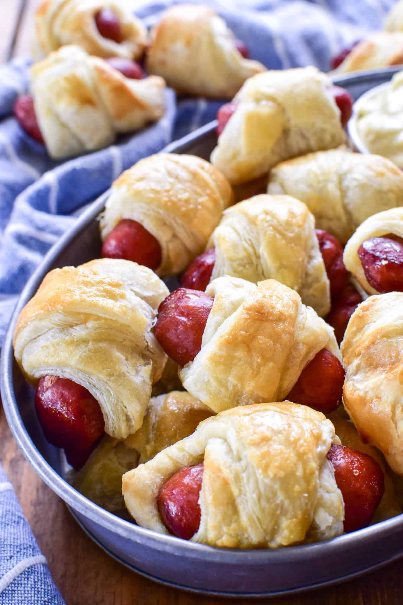 Close up of Pigs in a blanket in a metal serving tin