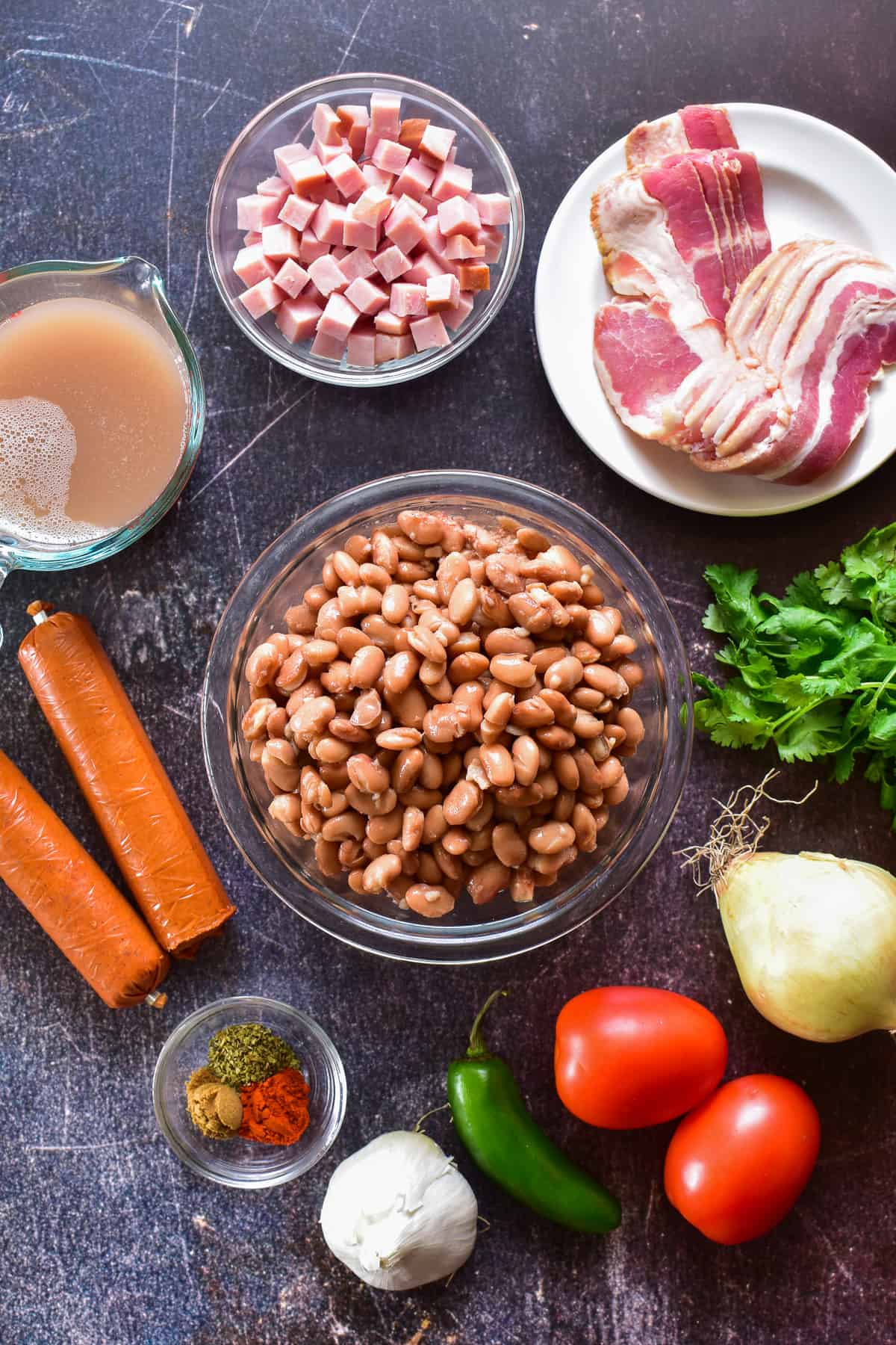 Charro Beans ingredients on a dark background