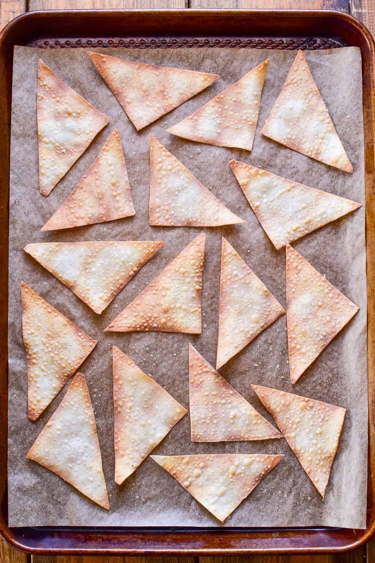 Wonton Chips on a baking sheet lined with parchment paper
