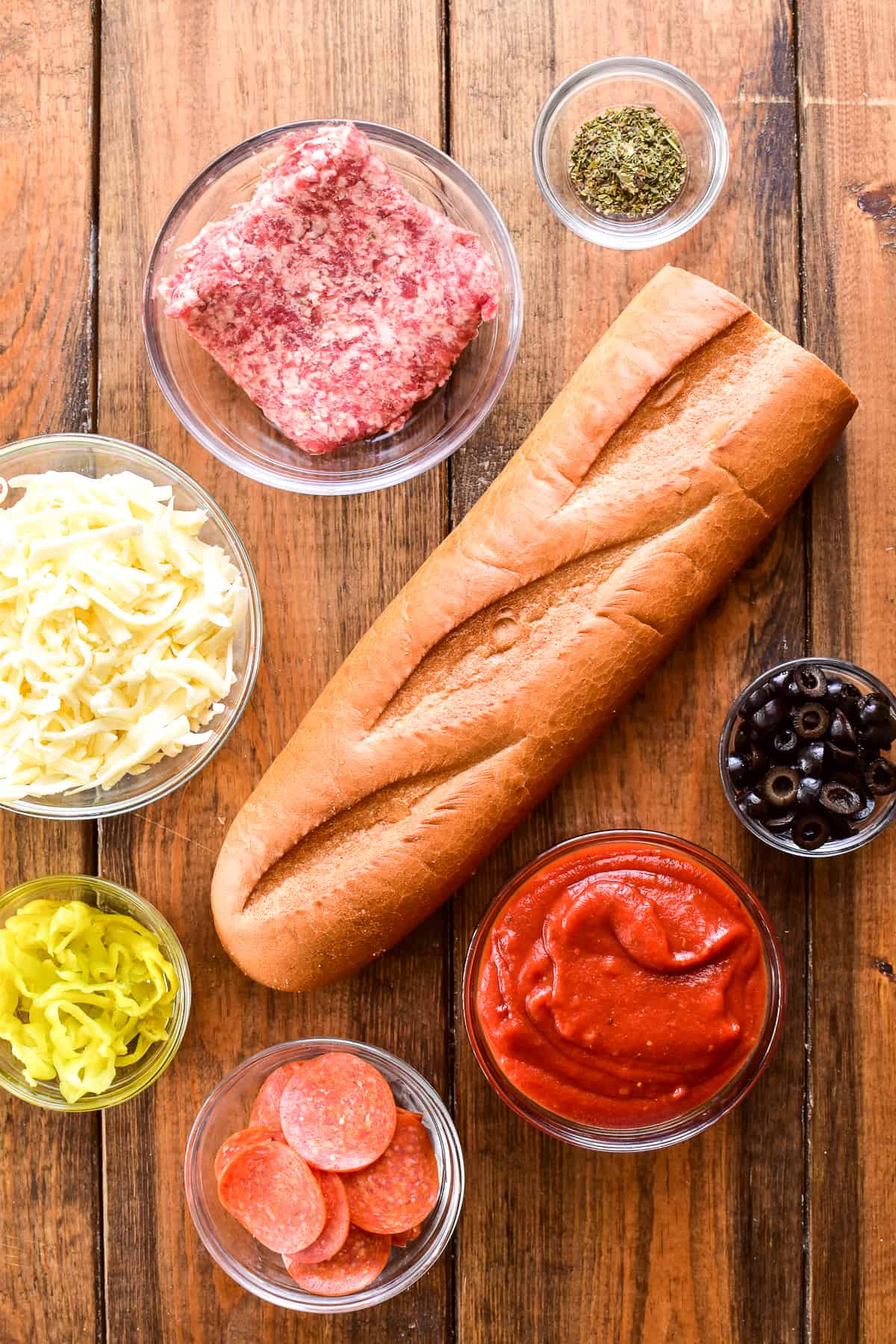 French Bread Pizza ingredients on a wooden background